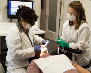 Two nurses with patient